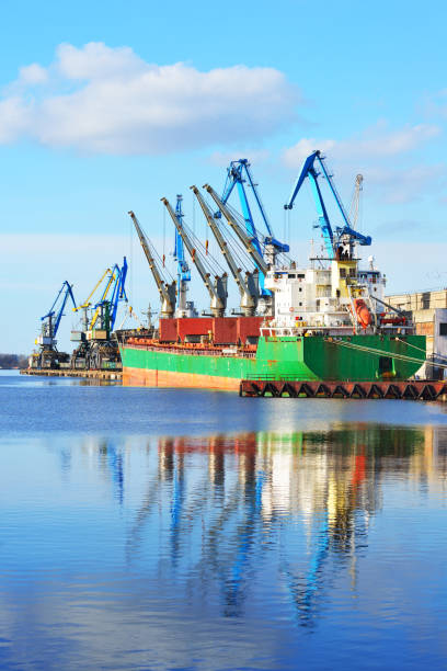 istock port cargo cranes and ship fragment at the docks 913007336