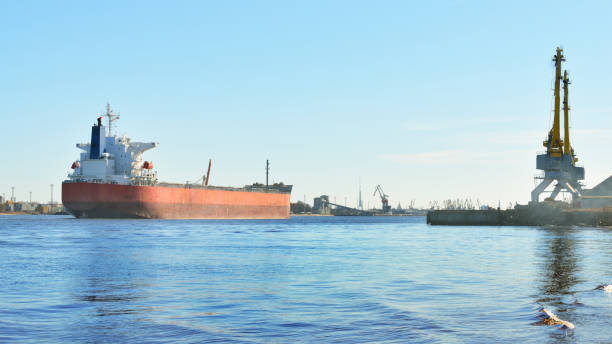 istock port cargo cranes and ship fragment at the docks 913007340