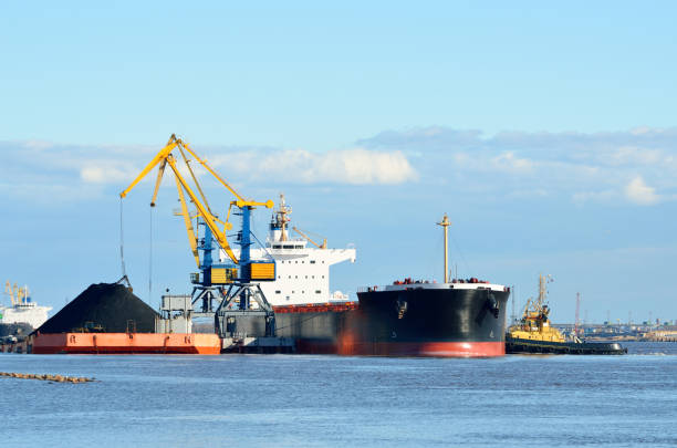 istock port cargo cranes and ship fragment at the docks 913009202
