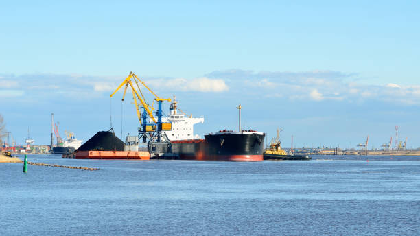 istock port cargo cranes and ship fragment at the docks 913009214