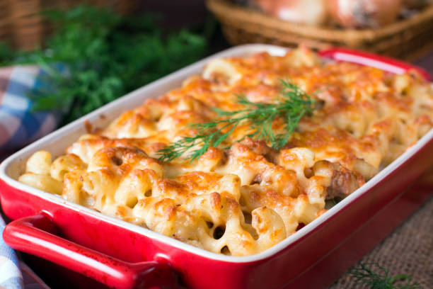 istock Pasta casserole with cheese and ham with tomato and cream sauce 913009770