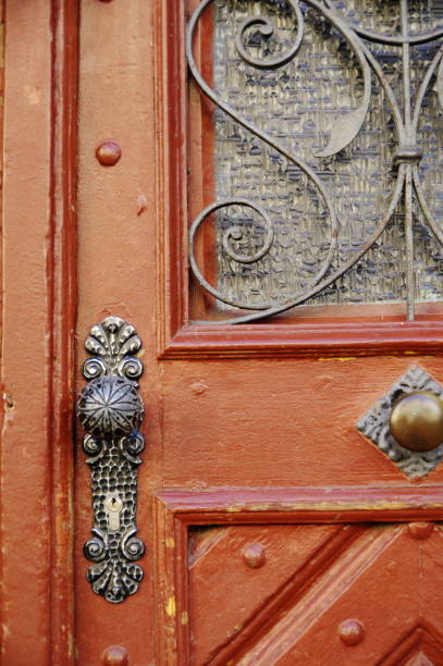 istock Old front door with glass and wrought iron decoration 913010690