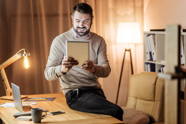istock Handsome male person using his gadget 913017056