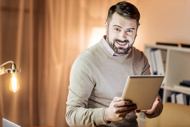 istock Portrait of delighted man that posing on camera 913017198