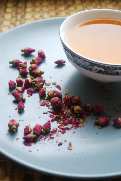 istock Cup of rose tea with rosebuds on the plate. 913017582