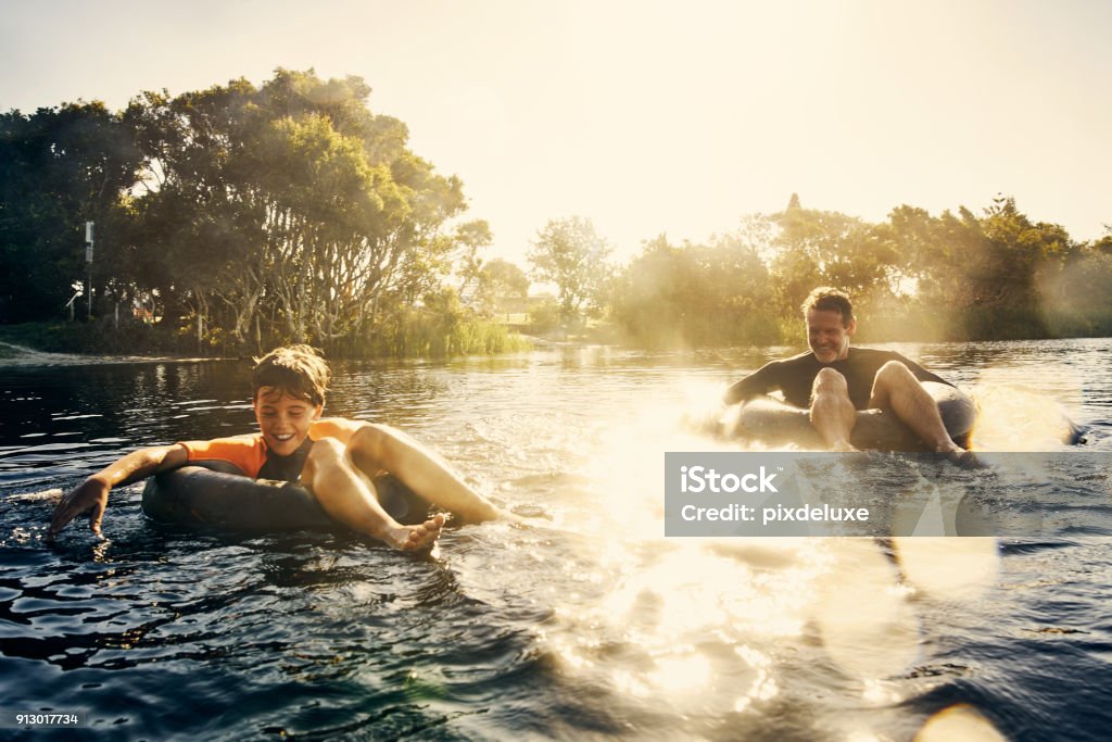 Having such fun today Shot of a father and son enjoying a day outdoors Family Stock Photo