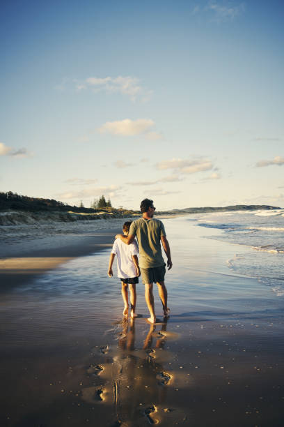 Footprints will be washed away, memories are here to stay Shot of a father and son enjoying a day outdoors footprint photos stock pictures, royalty-free photos & images