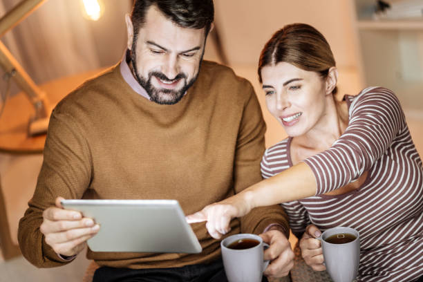 istock Amazing female pointing at tablet 913017964