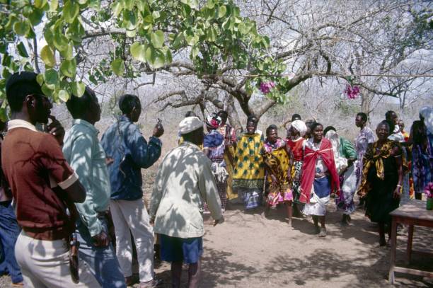 Congo, Central Africa, 1977. Women and men of a village community face each other. It's a kind of grooming show for prospective marriages.