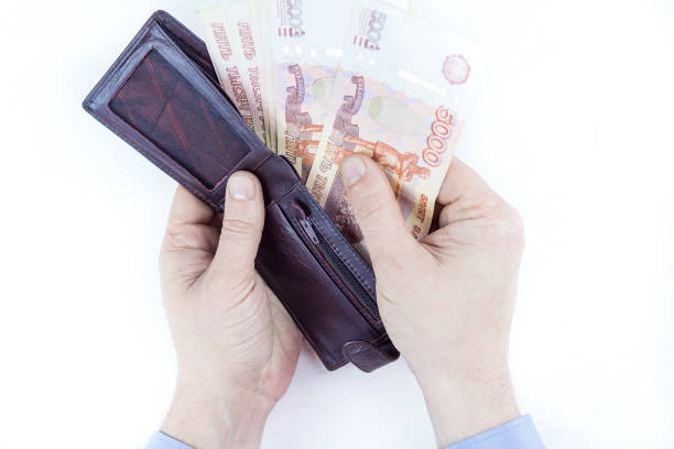 istock purse with money in hands 913022524