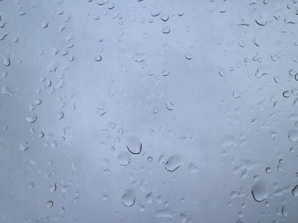 istock drops of rain on a window in the morning sky 913022714