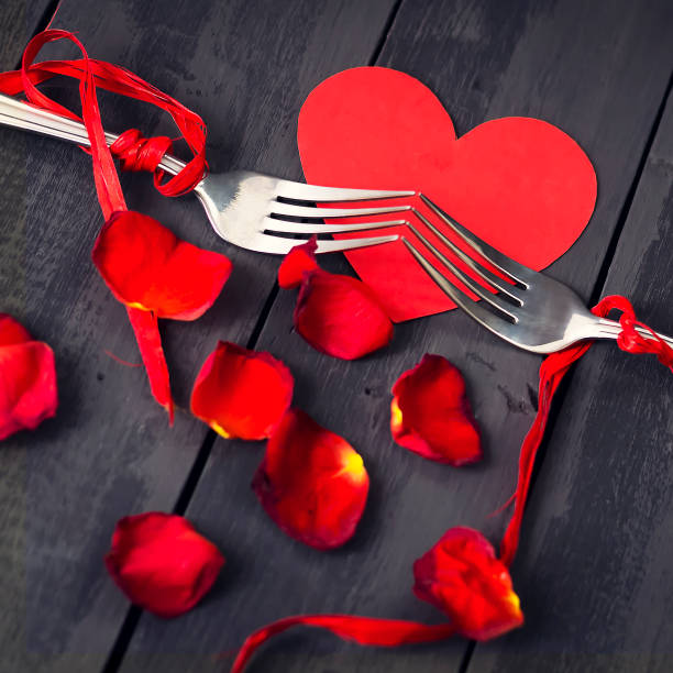 red paper hearts, rose petals and fork with ribbon. dark wooden background. copy space. valentine's day. - adhesive note note pad clothespin reminder imagens e fotografias de stock