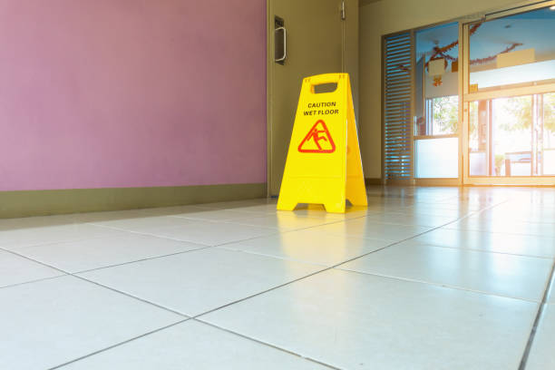 istock Caution wet flooring signboard and cleaning 913027702