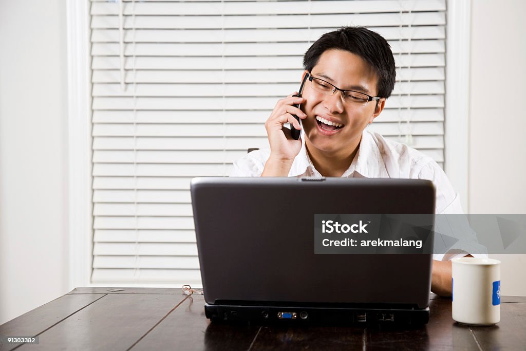 Asian entrepreneur on the phone  20-29 Years Stock Photo