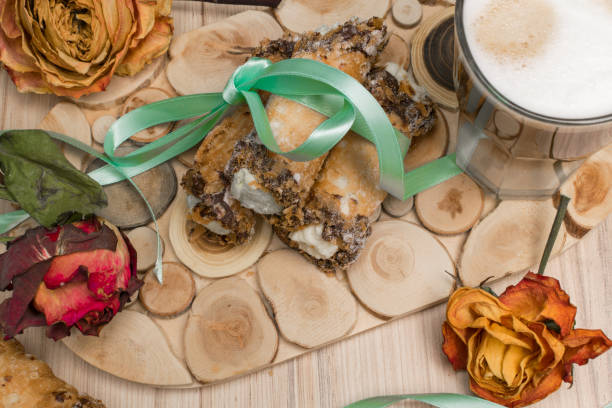 cannoli sweets with rose decoration