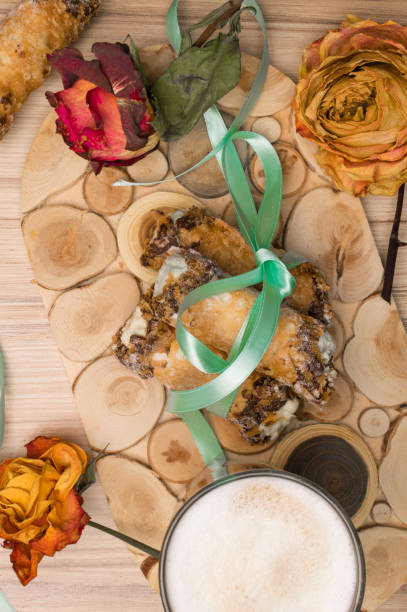 cannoli sweets with rose decoration