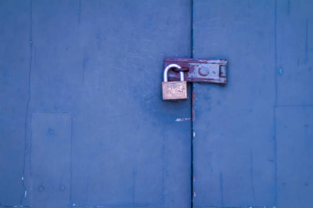 istock Padlock on a wooden door 913034516