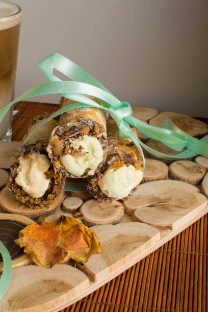 cannoli sweets with rose decoration