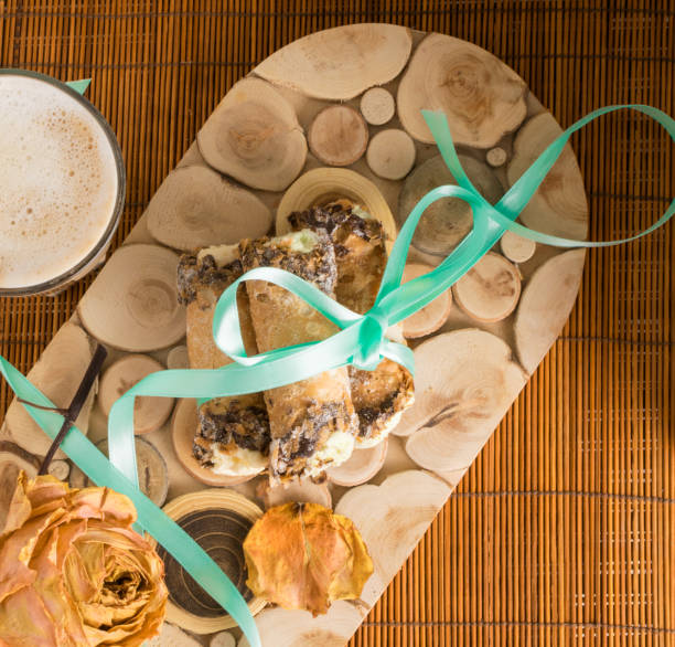 cannoli sweets with rose decoration