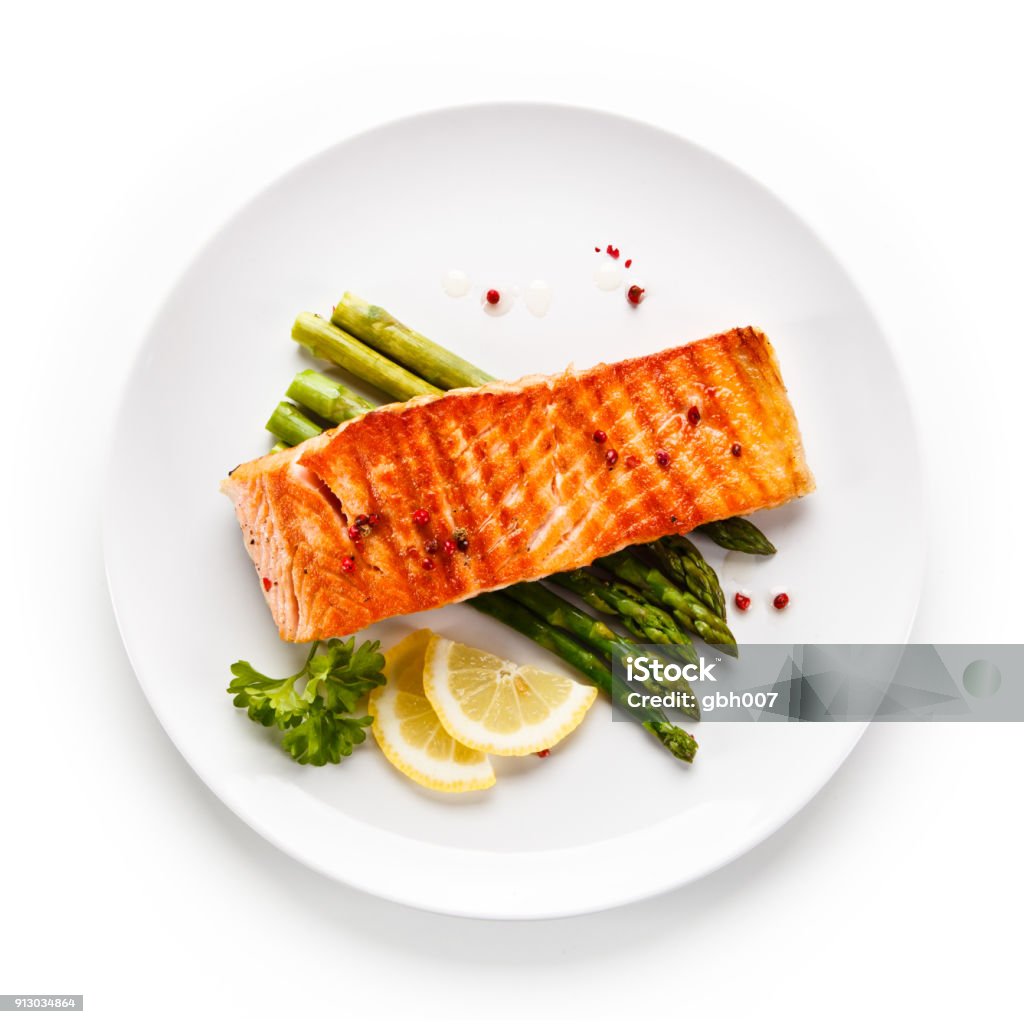 Fish dish - grilled salmon and asparagus Fish dish - roast salmon Salmon - Seafood Stock Photo