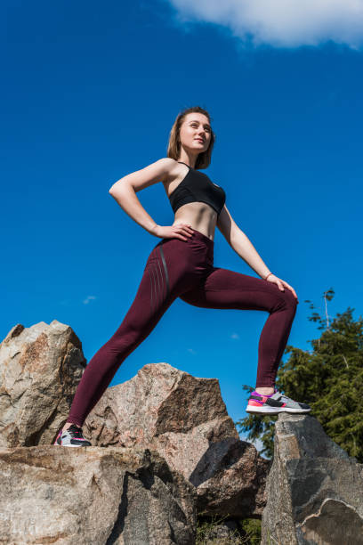 istock fit woman on rocks 913042766