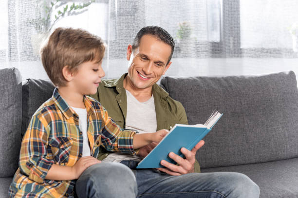 istock father and son reading book together 913046098