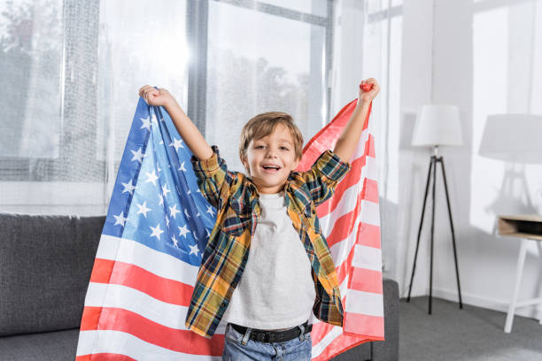 istock little boy with american flag 913046328