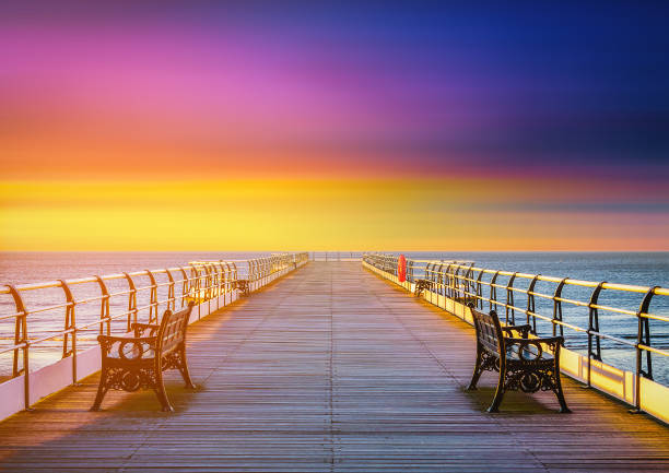 The wooden pier at sunset in Saltburn by the Sea, North Yorkshire, UK The wooden pier at sunset in Saltburn by the Sea, North Yorkshire, UK cleveland england stock pictures, royalty-free photos & images
