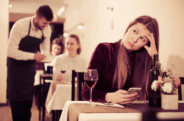 istock Sad woman is dining in luxury restaurante alone 913054764