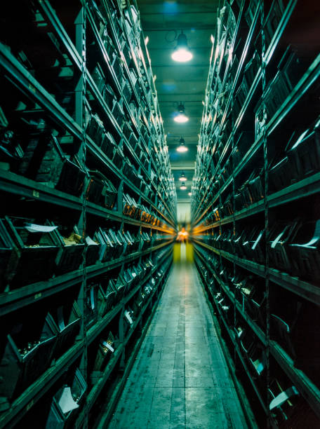 istock Deep perspective of industrial warehouse corridor with forklift 913058932