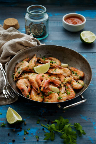 istock Shrimp fried in a frying pan with garlic and spices 913062018