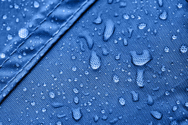 istock Dark blue rainproof tent sheet with morning rain drops 913062556