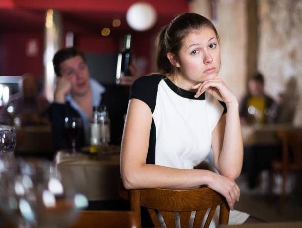 istock Woman unhappy  because her boyfriend drinking in cafe 913065124