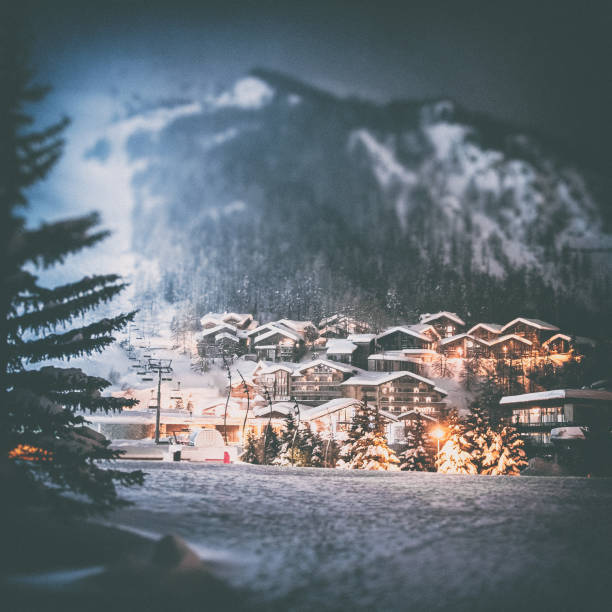 val d'isere french ski resort illuminated village by snowy night in european alps in winter - mountain ski snow european alps imagens e fotografias de stock