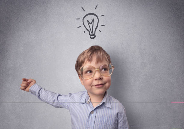 istock Smart kid in front of a drawn up grey wall 913065208