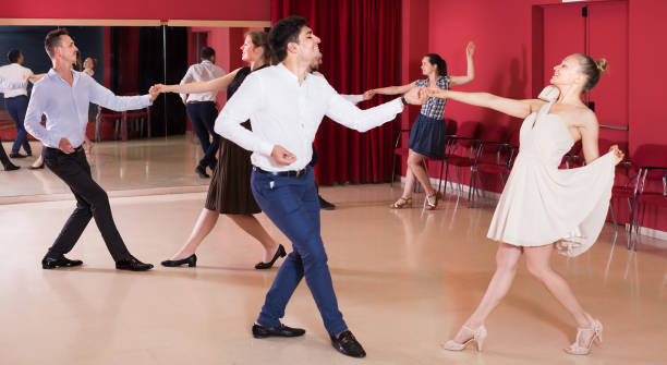 istock Positive group people dancing lindy hop in pairs 913065796