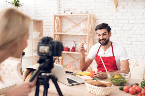 istock Chef prepering food ingredients for culinary podcst viewers. 913065940