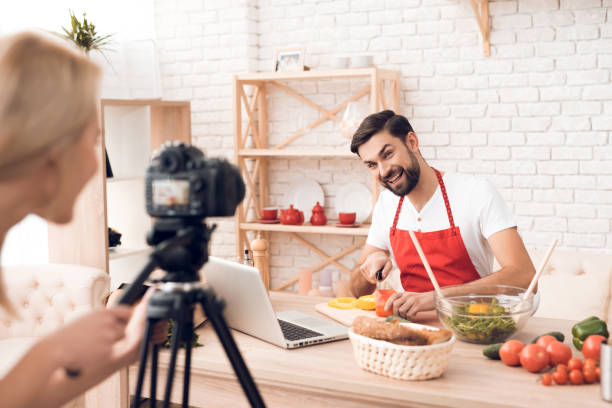 istock Chef prepering food ingredients for culinary podcst viewers. 913065944