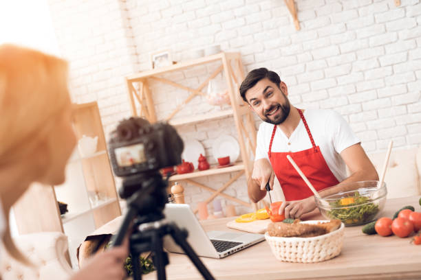 istock Chef prepering food ingredients for culinary podcst viewers. 913065972