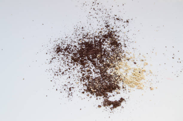 istock Brown and beige eye shadow scattered on white background, texture for makeup 913068500