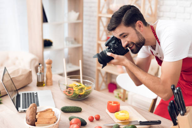 istock Chef shooting food ingredients for culinary podcast viewers. Vegetables and kitchen utensils. 913068520