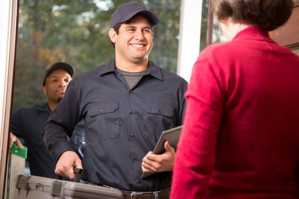istock Repairmen arrive at customer's front door for home repairs. 913069546
