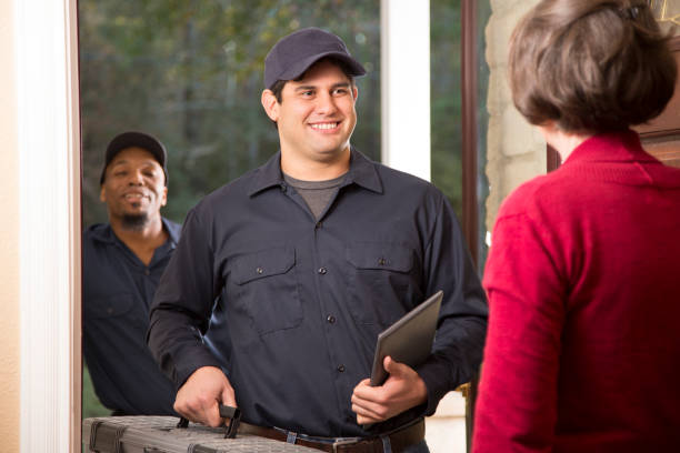istock Repairmen arrive at customer's front door for home repairs. 913069734