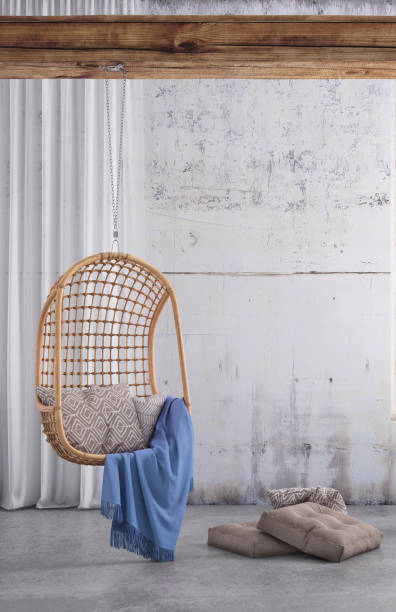 istock Modern hipster interior with pendant chair window and curtains with copy space wall 913084036