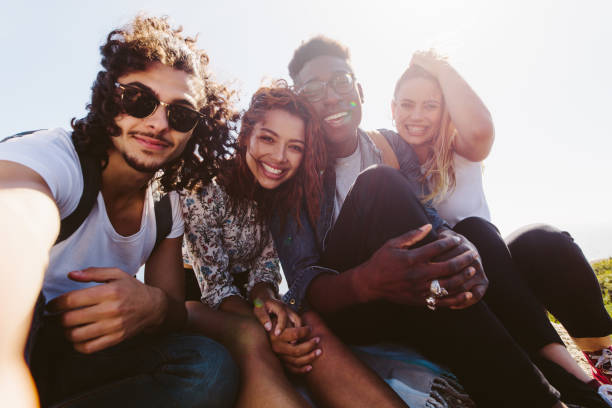 istock Smiling friends taking selfie on a holiday 913084456