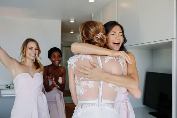 istock Bridesmaid congratulating the bride before wedding ceremony 913086948