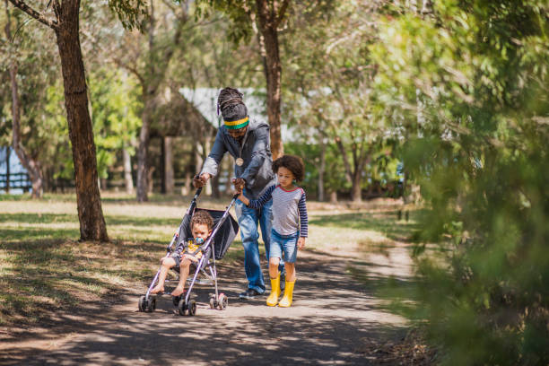 istock Father with his two children at a farm 913087086