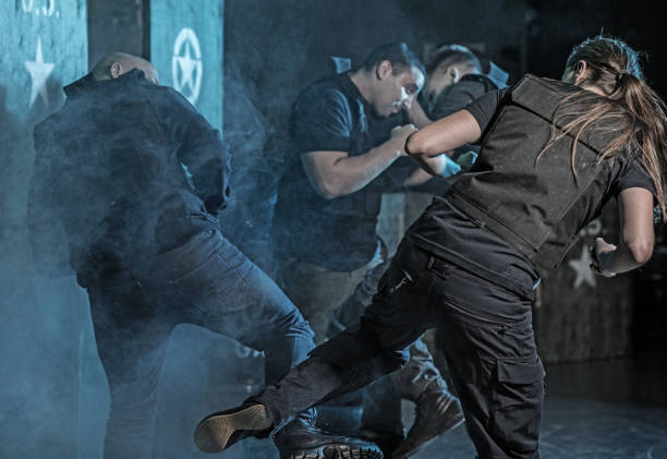 istock Female Krav Maga fighting instructor sparring during training session in grimy outdoor setting 913088258