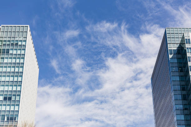 istock Modern building facade with rectangle and square windows form place in side of frame with clear blue sky with cloud in Sapporo at Hokkaido, Japan. 913090434
