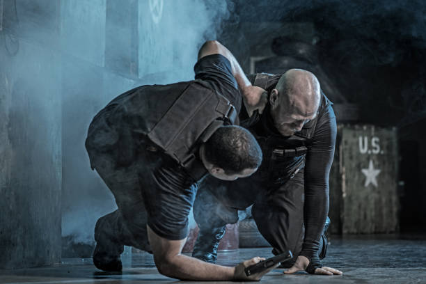istock Krav Maga fighting duo sparring during disarmament training session in grimy outdoor setting 913090632